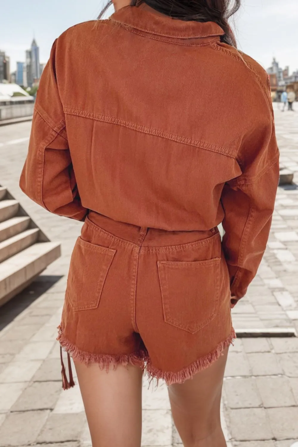 Edgy Distressed Denim Snap Romper with Raw Hem